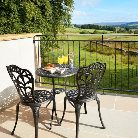 Take in rolling hill views over an alfresco breakfast on the balcony