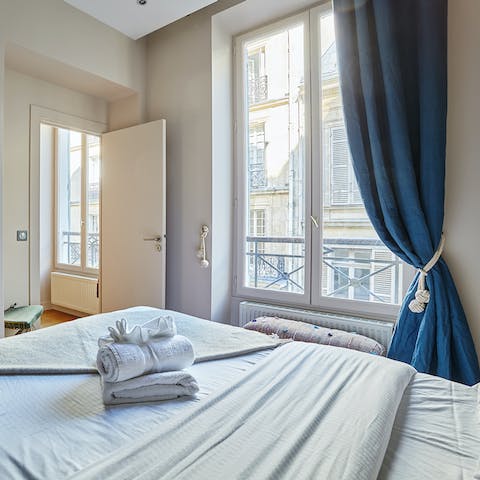 Wake up to views of the bustling Parisian streets down below