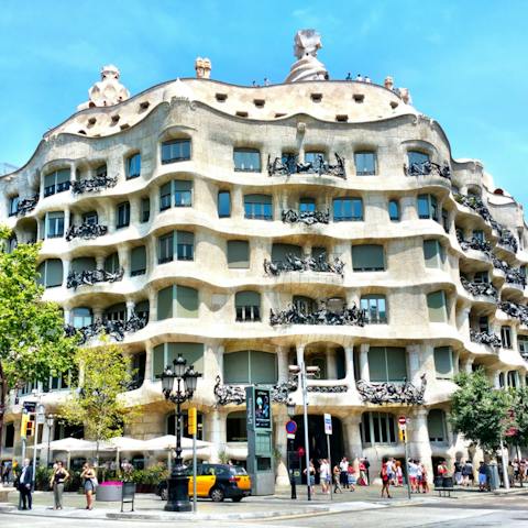 Visit Gaudí's eye-catching Casa Milà, within walking distance of your home