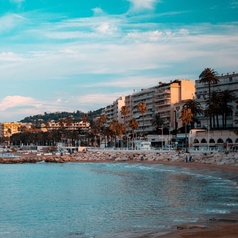 Visit La Croisette and stroll down Cannes' iconic seaside boardwalk