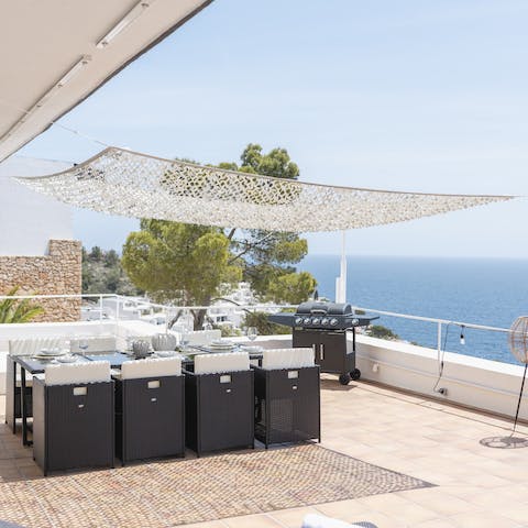Tuck into grilled meats on your alfresco dining set as you gaze at ocean views