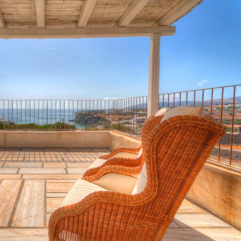 Take shade in a comfortable lounger as you admire the surrounding landscape