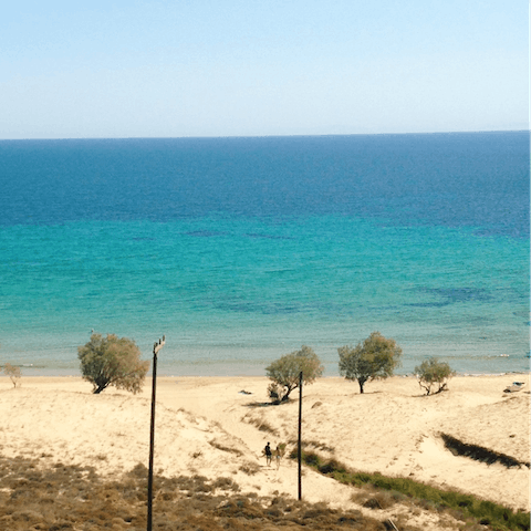 Take a seven-minute wander down to Elia Beach for a day on the sand