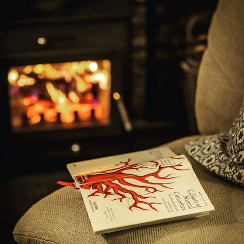 Curl up around the woodburner after a day of hiking and exploring