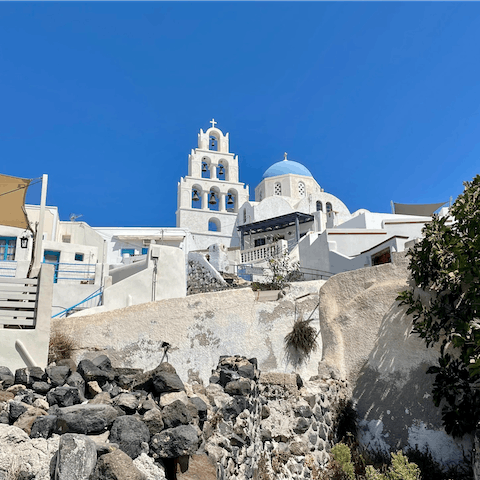 Explore Santorini from the charming village of Pyrgos