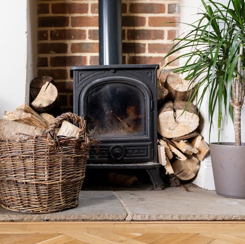 Place some logs in the wood burner and get cosy during movie night
