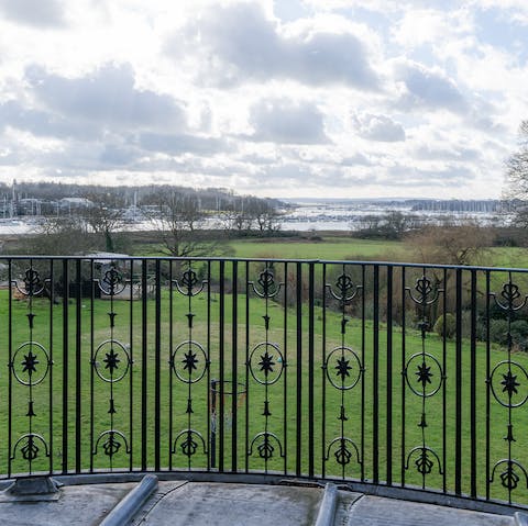 Admire the view of the Hampshire countryside from the master bedroom's balcony
