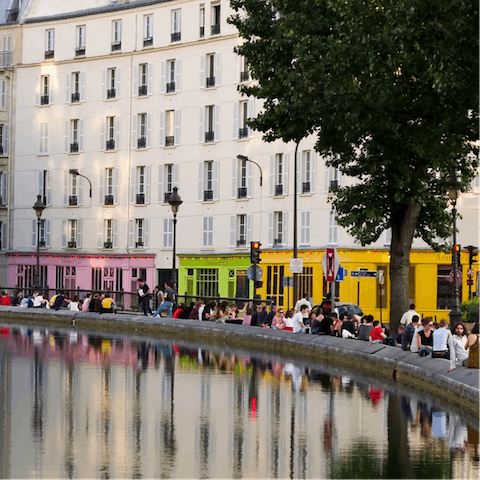 Explore vibrant Canal Saint-Martin and its many canalside eateries