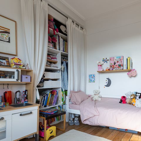 Let the little ones play in their own bedroom, full of toys and books