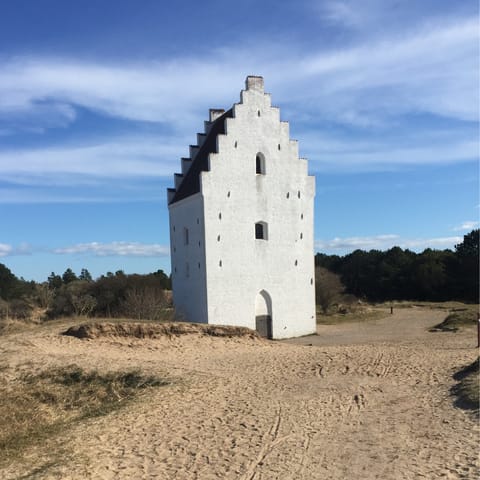 Visit the Sand-Covered Church in Skagen, a twenty-minute drive away