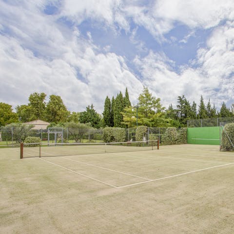 Kick off a friendly game of tennis in the full-sized court