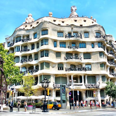 Stroll thirteen minutes up to the road to see the famous Casa Milà