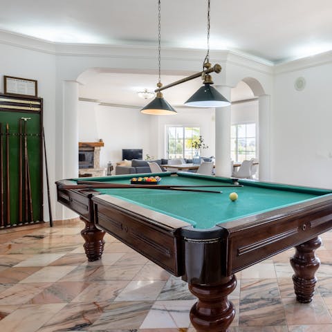 Let out your competitive side in the billiards room