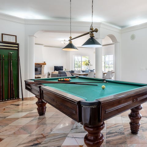 Let out your competitive side in the billiards room