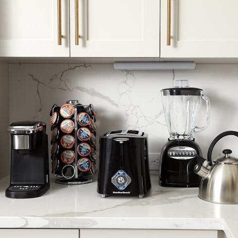 Kick off the morning with an energizing smoothie or a strong coffee in your fully stocked kitchen