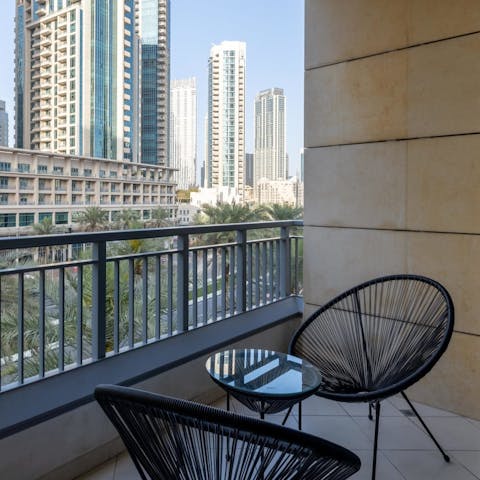 Savour your morning coffee on the balcony, looking out to the gorgeous vista of skyscrapers, palm trees, and blue skies