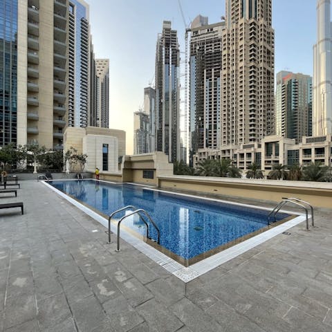 Spend blissful mornings beside the pool, catching up on your book while enjoying the cityscape view