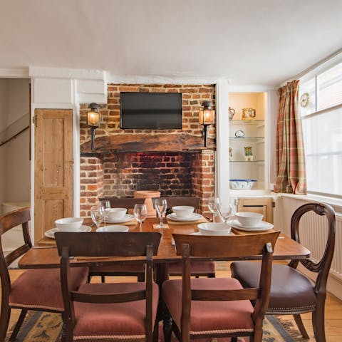 Gather your ensemble for a hearty group meal in front of the brick hearth