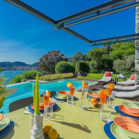 Admire the beautiful lake views over Aperols on the terrace
