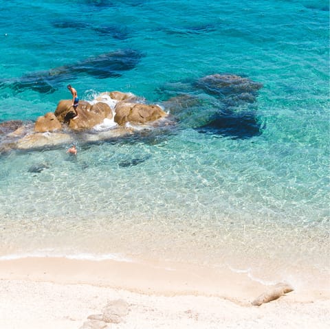 Pack a beach bag and take the short stroll to Agios Stefanos
