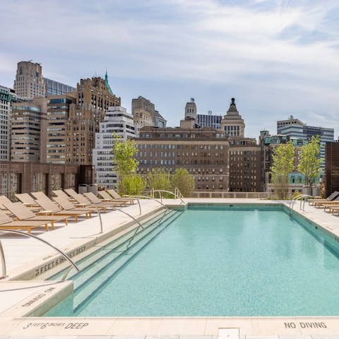 Take a refreshing dip in the shared rooftop pool