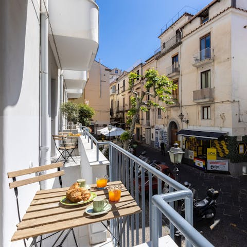 Savour a glass of local limoncello on the balcony