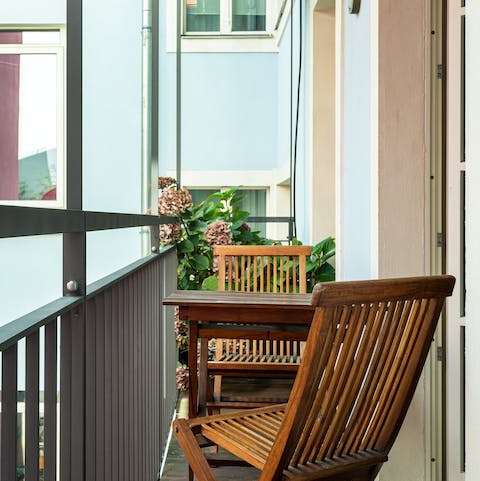 Enjoy your morning coffee on the private balcony