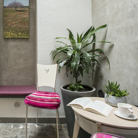 Enjoy a Campari and soda surrounded by plants in the internal courtyard