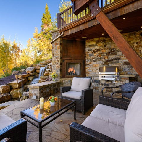 Enjoy true tranquillity with the waterfall feature and outdoor fireplace