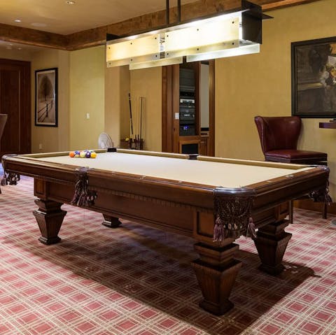 Play a round of pool in the games room 