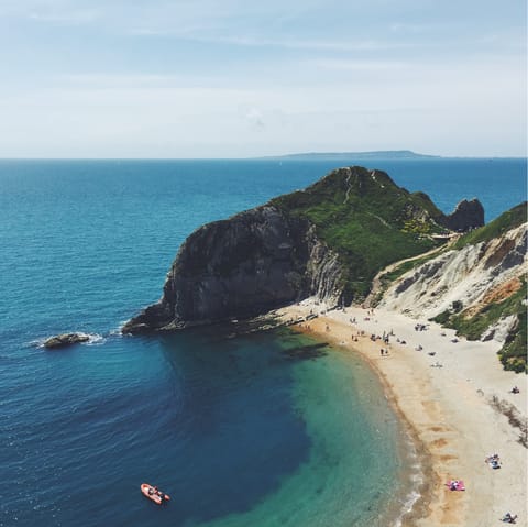 Head down to the awe-inspiring Jurassic Coast to marvel at its dramatic cliffs and bright blue water