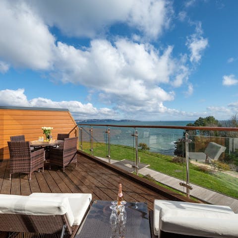 Kick your feet up on the balcony and enjoy views of Fishcombe Cove