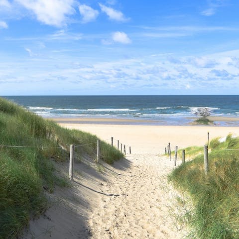 Enjoy the beautiful sandy beach located a fifteen-minute walk away 