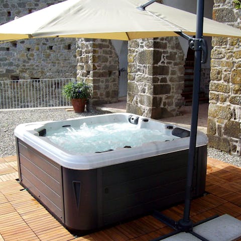 Enjoy a relaxing soak in the bubbly hot tub