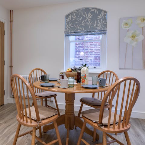 Set the table ready for a hearty breakfast in the tidy kitchen
