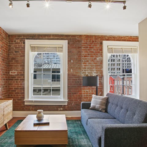Relax in a modern space that highlights original features from 1858