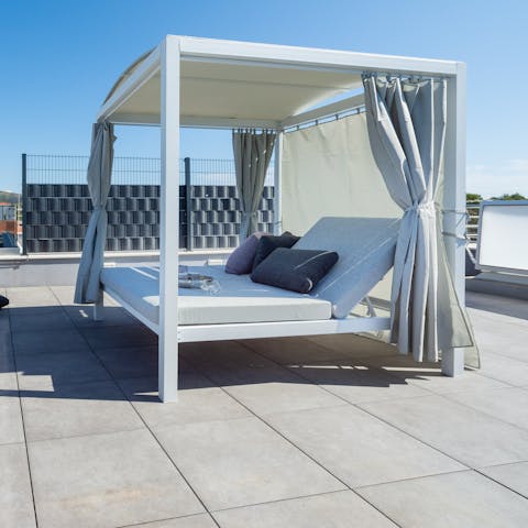 Soak up the Croatian sun from the rooftop day bed