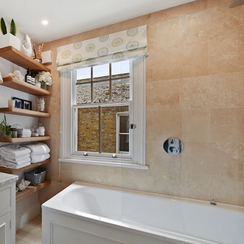Close your eyes and relax in the svelte bathtub