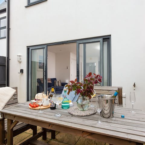 Dine alfresco on the cute garden table