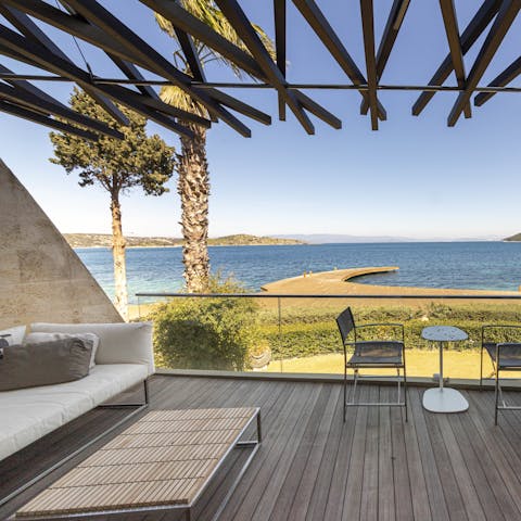 Admire the beautiful sea view from your outdoor lounge