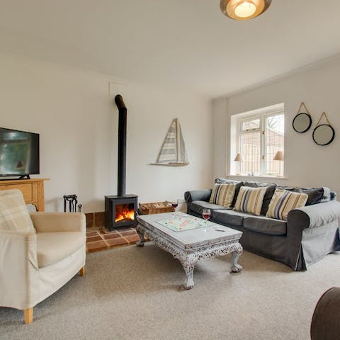 Relax by the wood burner fireplace on chilly winter nights
