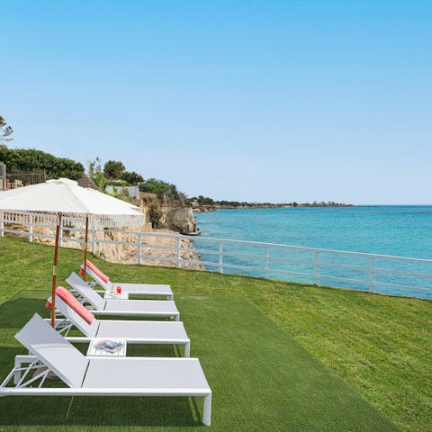 Soak up the sea views from the comfort of the sun loungers