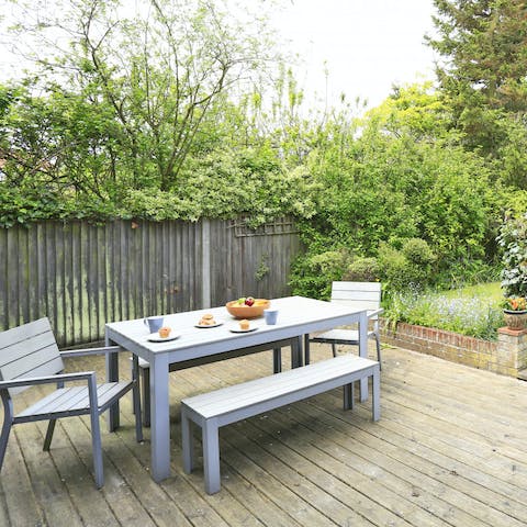 Relax on the private patio with a pretty garden, after a day on Southwold Beach 