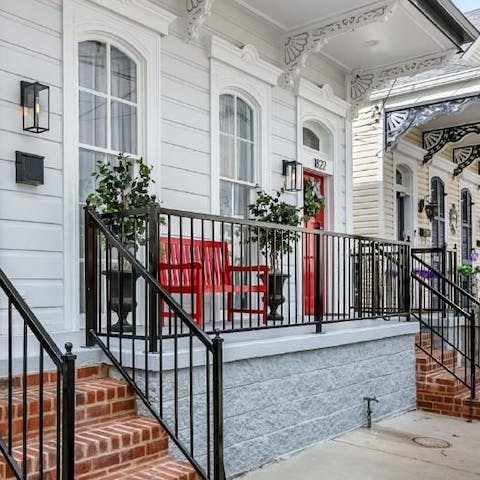 Enjoy your morning coffee on the Southern-style porch, taking in the sounds of the city