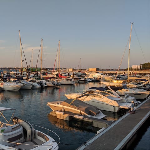 Sip cocktails by the marina in Troia – it's a quick drive away