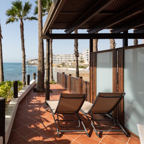 Soak up some vitamin D at the same time as the views from your private terrace