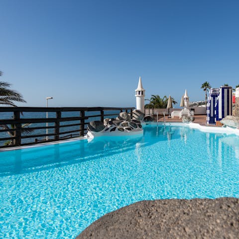 Take a refreshing dip in the pool with sparkling sea views