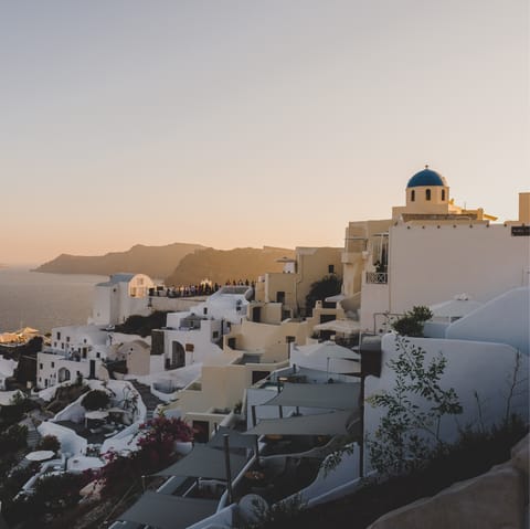 Make the 8km drive to Thera and go sightseeing on Santorini's west coast