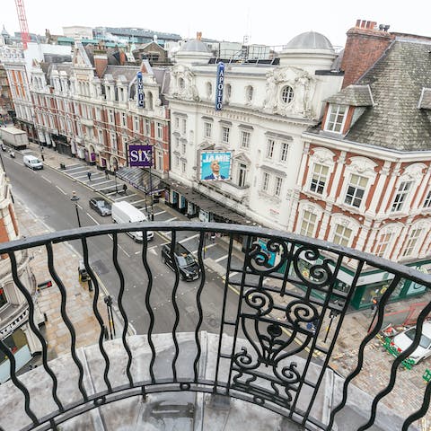 Watch Shaftesbury Avenue shine at nighttime from your balcony
