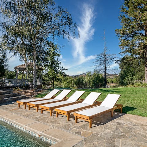 Catch the Californian rays from a sun lounger by the pool